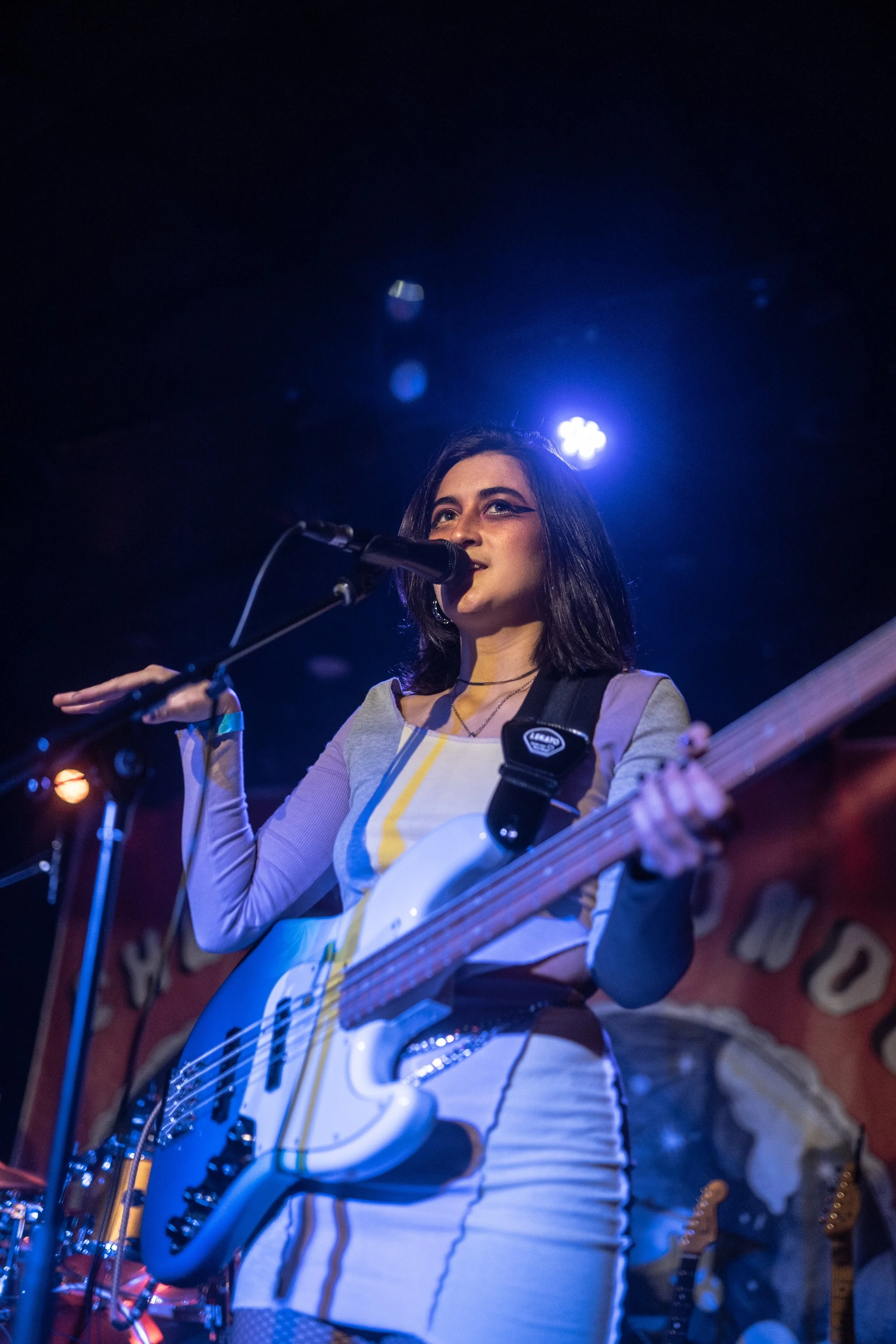   Sara Keden pauses her guitar playing to interact with fans during a live set. Photo courtesy of Kid Sistr  